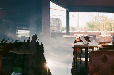 People on glass window of building