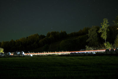 Scenic view of field against sky at night