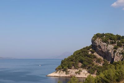 Scenic view of sea against clear blue sky