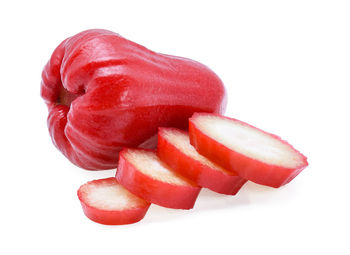 Close-up of fruits over white background