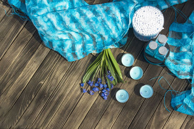 High angle view of purple flower on wooden table