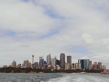 City skyline against cloudy sky