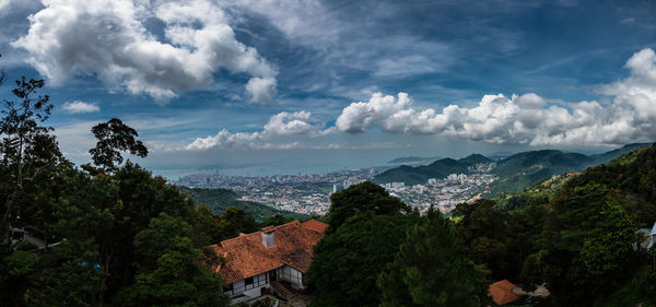 High angle view of trees and buildings against sky