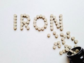 Close-up of pills on white background