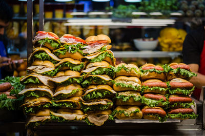 Hamburgers arranged on tray in commercial kitchen