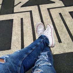 Low section of woman standing on tiled floor