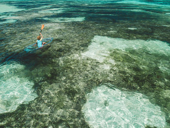 High angle view of man swimming in sea