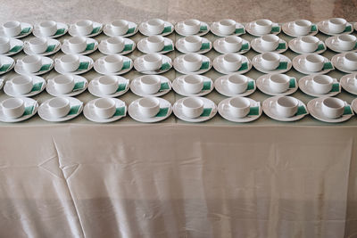 Empty coffee cup for wedding banquet conference seminar catering event. tea coffee break service