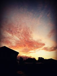 Silhouette of built structure at sunset