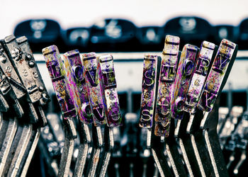 Close-up of padlocks hanging on railing