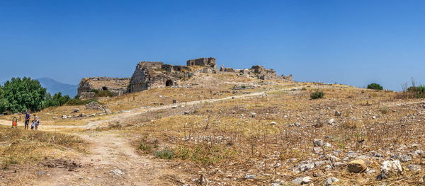 Ruins of building against blue sky