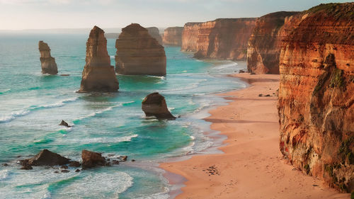 Panoramic view of rocks on beach against sky