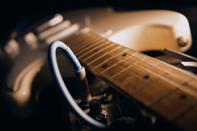 Close-up of guitar and amplifier