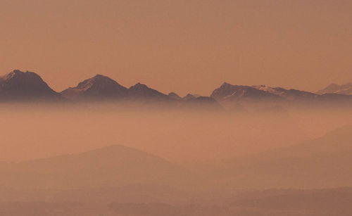 Scenic view of mountains against sky during sunset