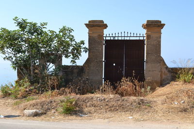 Abandoned building against clear sky