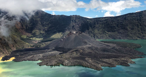 Scenic view of volcanic mountain against sky