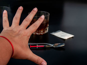 Close-up of hand holding book