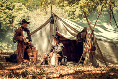 Man sitting on tent