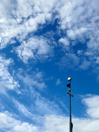 Low angle view of street light against sky