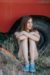 Portrait of beautiful woman sitting in car