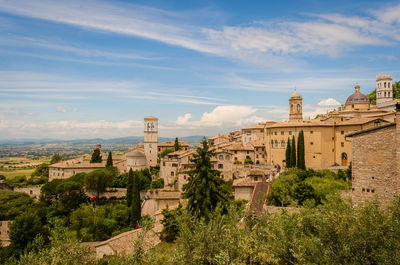 Panoramic view of buildings in city against sky