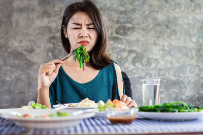 Young woman eating food