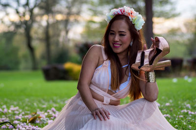 Portrait of young woman in park