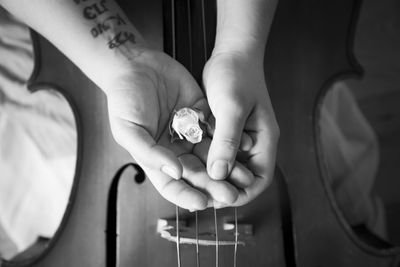 Cropped image of woman hands with cello
