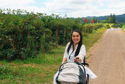 Portrait of a smiling young woman outdoors