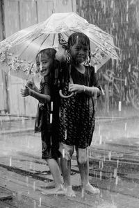 Full length portrait of a girl in rain