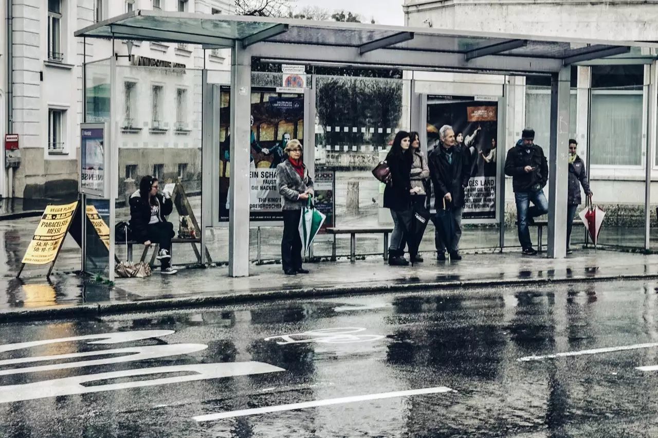 wet, architecture, group of people, building exterior, rain, city, built structure, street, real people, men, people, walking, city life, reflection, rainy season, lifestyles, women, day, water, outdoors