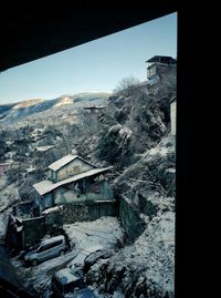 High angle view of buildings against sky during winter