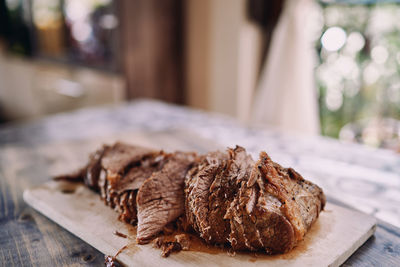 Close-up of meat on cutting board