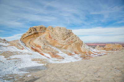 Rock formations on landscape against sky