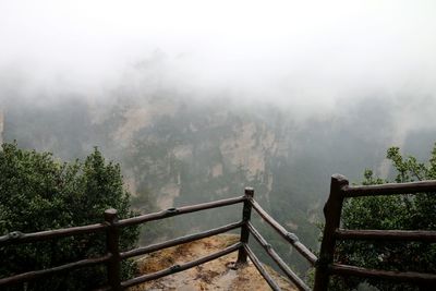 Scenic view of trees and mountains against sky