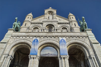 Low angle front view of sacre coeur basilica