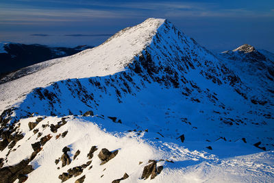 Scenic view of snowcapped mountain at retezat national park