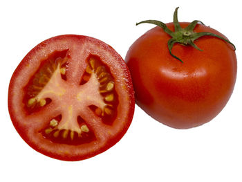 Close-up of red apple against white background