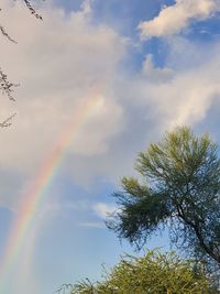 Low angle view of rainbow against sky