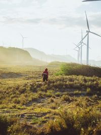 Rear view of man walking on land