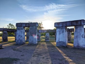 Built structure on field against sky