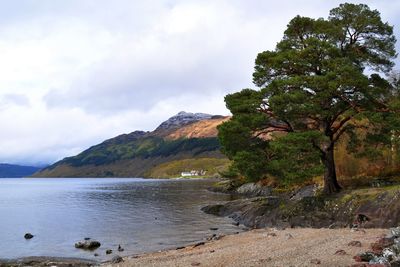 Scenic view of loch lomond and mountain against sky