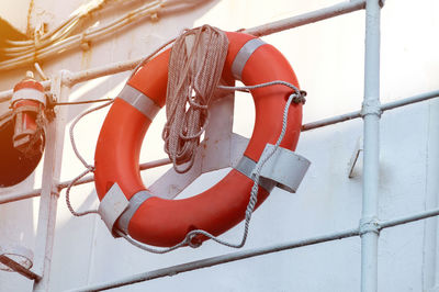 Close-up of tied hanging on rope