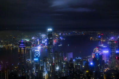 High angle view of illuminated city buildings at night