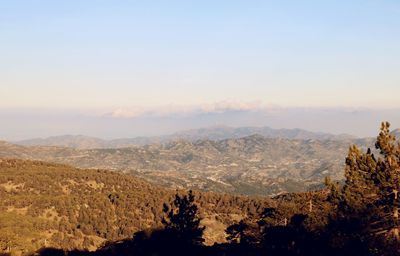 Scenic view of landscape against sky
mount olympus in background with sun, shadow and baby blue sky
