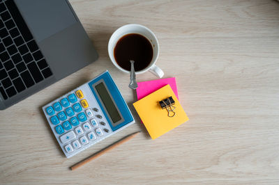 High angle view of coffee cup on table