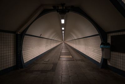 Interior of empty illuminated tunnel