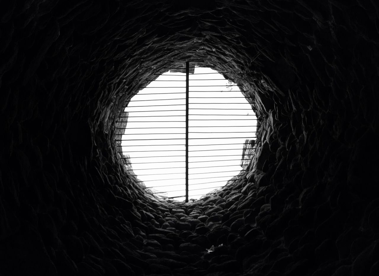 indoors, dark, arch, pattern, silhouette, built structure, reflection, architecture, backgrounds, window, full frame, circle, no people, hole, tunnel, ceiling, textured, low angle view, close-up, geometric shape