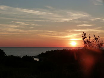 Scenic view of sea at sunset