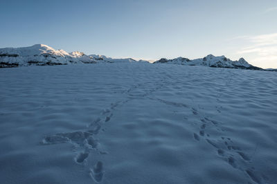 Scenic view of snowcapped mountains against sky